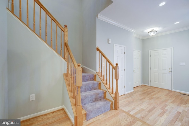 319 Chestertown St, Gaithersburg, MD 20878 - entrance foyer featuring wood finished floors, crown molding, recessed lighting, and stairs