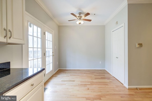 319 Chestertown St, Gaithersburg, MD 20878 - unfurnished dining area with plenty of natural light, light wood finished floors, a ceiling fan, and crown molding