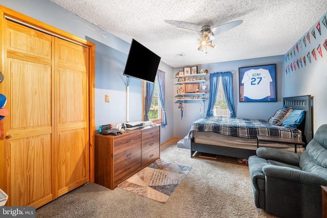 199 Cox Ave, West Creek, NJ 08092 - bedroom featuring light colored carpet, a textured ceiling, and ceiling fan