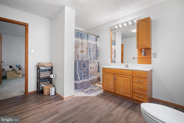 199 Cox Ave, West Creek, NJ 08092 - bathroom featuring wood finished floors, vanity, a textured ceiling, and a shower with shower curtain