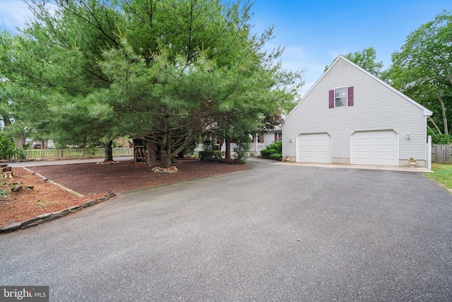199 Cox Ave, West Creek, NJ 08092 - view of front of home with driveway and a garage