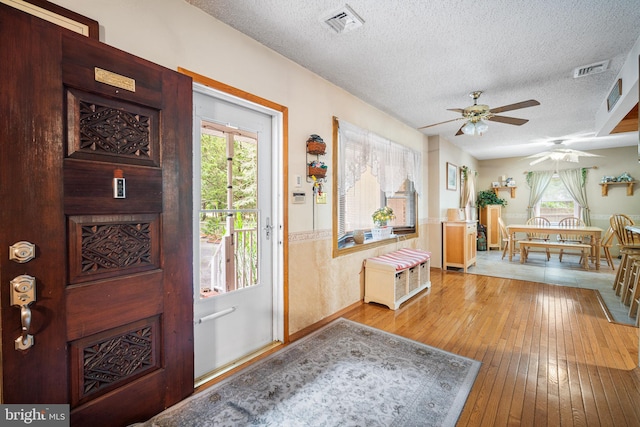 199 Cox Ave, West Creek, NJ 08092 - entryway with a textured ceiling, hardwood / wood-style flooring, ceiling fan, and healthy amount of natural light