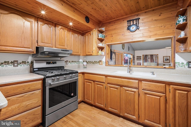 199 Cox Ave, West Creek, NJ 08092 - kitchen featuring stainless steel gas range oven, under cabinet range hood, open shelves, light countertops, and light wood finished floors