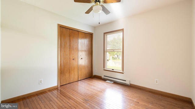 45 Wert Ave, Hamilton, NJ 08610 - unfurnished bedroom featuring a baseboard radiator, hardwood / wood-style flooring, a closet, and ceiling fan