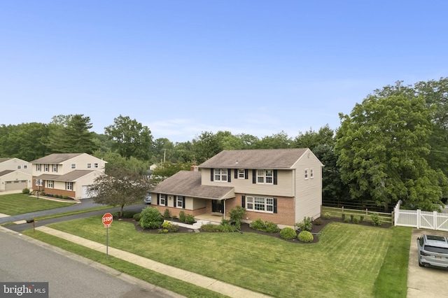 2108 Weatherton Dr, Wilmington, DE 19810 - view of front facade featuring brick siding, view of scattered trees, and a shingled roof