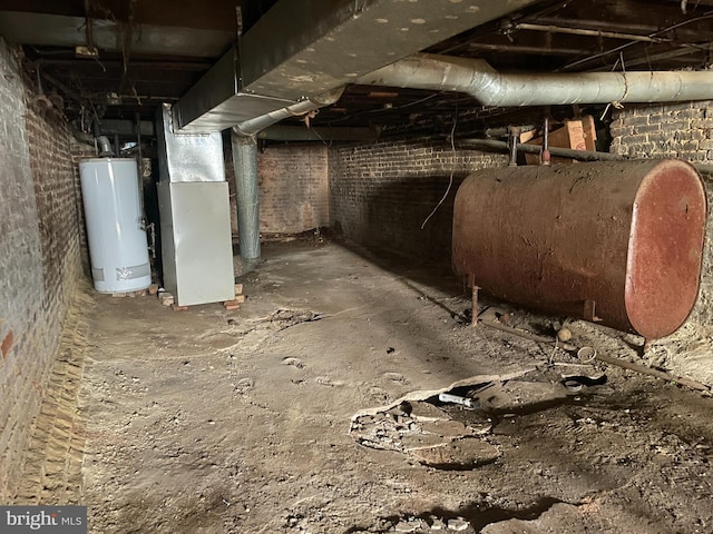 1 N Smallwood St, Baltimore, MD 21223 - unfinished basement featuring heating fuel, water heater, and heating unit