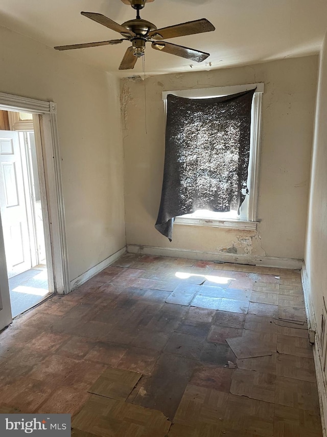 1 N Smallwood St, Baltimore, MD 21223 - empty room with healthy amount of natural light and ceiling fan