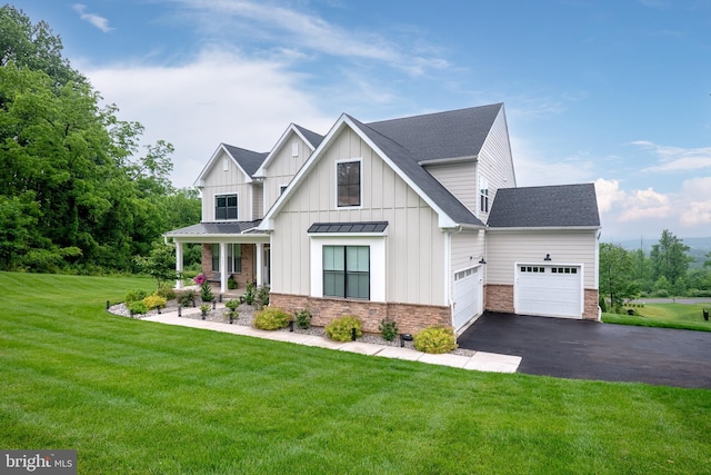 5635 Saucon Ridge Rd, Coopersburg, PA 18036 - modern farmhouse featuring asphalt driveway, a garage, a front lawn, covered porch, and board and batten siding