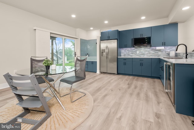 5635 Saucon Ridge Rd, Coopersburg, PA 18036 - kitchen with stainless steel appliances, blue cabinets, light countertops, and recessed lighting