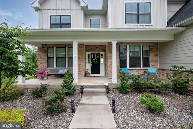5635 Saucon Ridge Rd, Coopersburg, PA 18036 - view of exterior entry with covered porch and board and batten siding