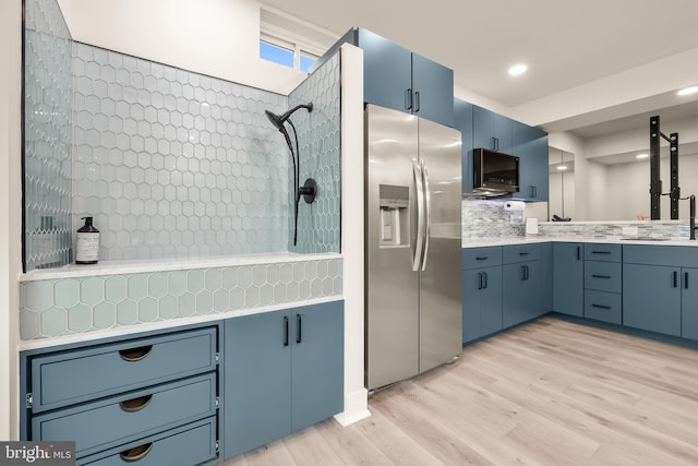 5635 Saucon Ridge Rd, Coopersburg, PA 18036 - kitchen featuring stainless steel fridge with ice dispenser, blue cabinets, light wood-type flooring, light countertops, and recessed lighting