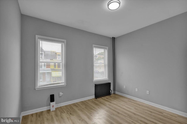 446 S 15th St, Reading, PA 19602 - unfurnished room featuring radiator heating unit and wood finished floors