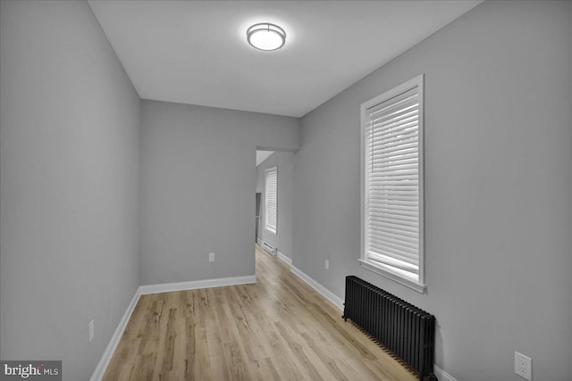 446 S 15th St, Reading, PA 19602 - empty room featuring radiator and wood finished floors