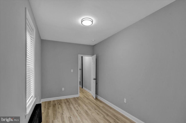 446 S 15th St, Reading, PA 19602 - unfurnished bedroom featuring baseboards and light wood-style floors