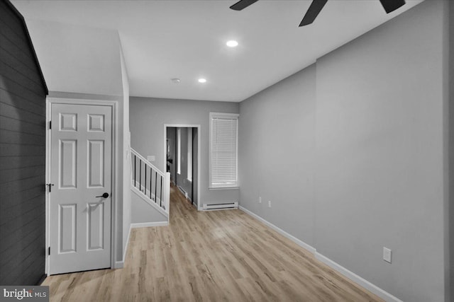 446 S 15th St, Reading, PA 19602 - empty room featuring baseboard heating, ceiling fan, wood finished floors, and recessed lighting