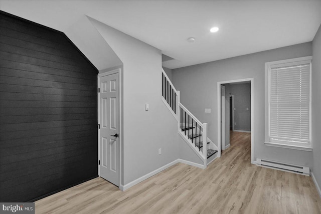 446 S 15th St, Reading, PA 19602 - stairway featuring a baseboard heating unit, wood finished floors, and recessed lighting
