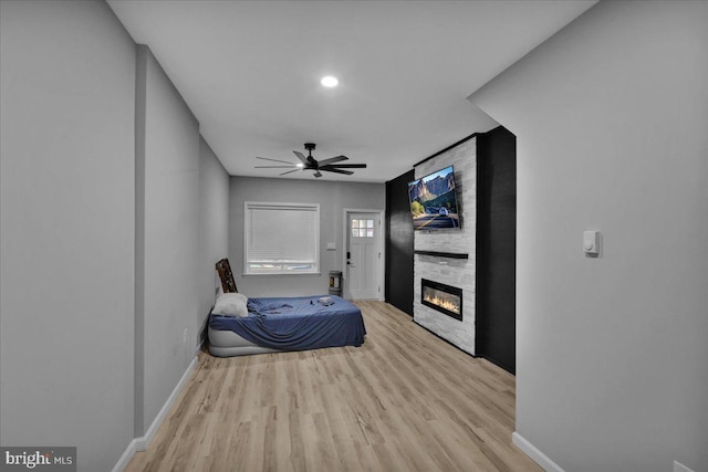 446 S 15th St, Reading, PA 19602 - bedroom with wood finished floors, a fireplace, a ceiling fan, and recessed lighting