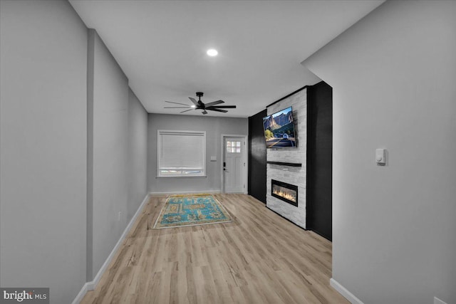 446 S 15th St, Reading, PA 19602 - unfurnished living room with a ceiling fan, light wood finished floors, a fireplace, and recessed lighting