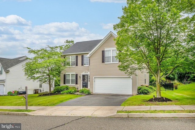 1506 Cloverhill Rd, Pottstown, PA 19464 - view of front of home featuring driveway, a garage, and a front lawn