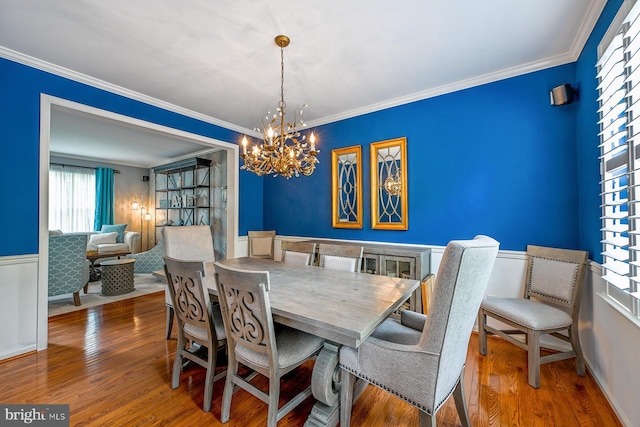 1506 Cloverhill Rd, Pottstown, PA 19464 - dining area featuring a chandelier, wood finished floors, and ornamental molding