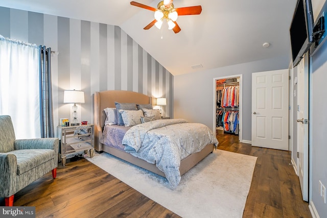 1506 Cloverhill Rd, Pottstown, PA 19464 - bedroom featuring wallpapered walls, vaulted ceiling, a walk in closet, dark wood-style floors, and a closet