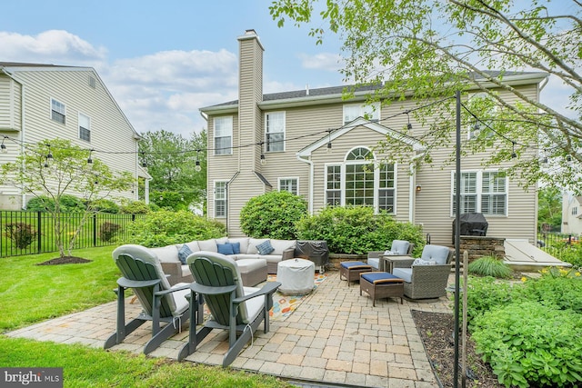 1506 Cloverhill Rd, Pottstown, PA 19464 - back of property featuring an outdoor hangout area, a patio area, a fenced backyard, and a chimney