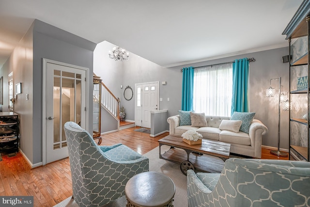 1506 Cloverhill Rd, Pottstown, PA 19464 - living area with stairs, light wood-style flooring, and ornamental molding