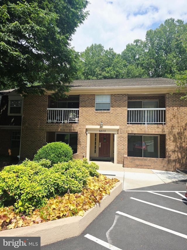 5825 Cove Landing Rd Unit 101, Burke, VA 22015 - view of property with uncovered parking