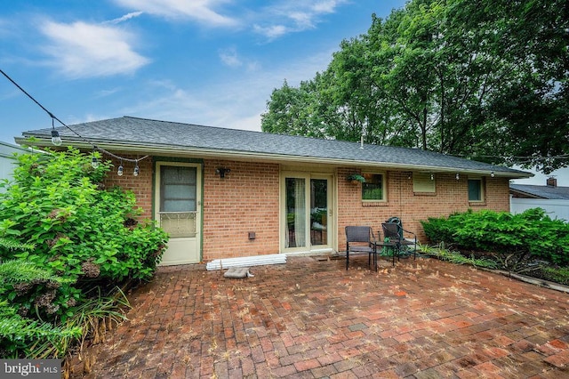 2170 Reading Blvd, Reading, PA 19609 - back of house featuring brick siding, a patio area, and roof with shingles