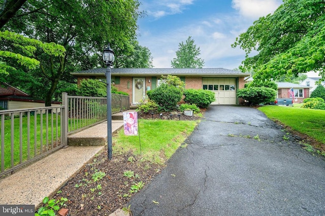 2170 Reading Blvd, Reading, PA 19609 - single story home featuring an attached garage, brick siding, a front lawn, and driveway