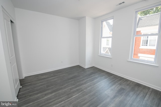 1615 Rowan St, Philadelphia, PA 19140 - unfurnished bedroom featuring dark wood-type flooring and baseboards