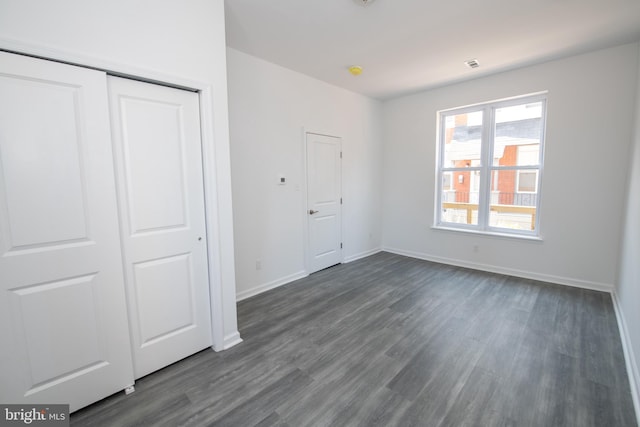 1615 Rowan St, Philadelphia, PA 19140 - unfurnished bedroom with dark wood-style flooring and a closet