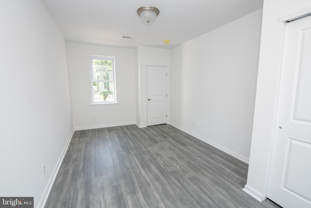 1615 Rowan St, Philadelphia, PA 19140 - empty room featuring dark wood-type flooring and baseboards