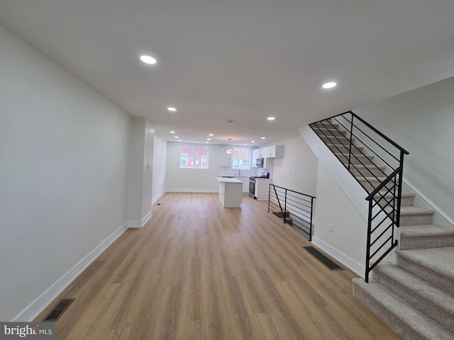 1473 Stevens St, Philadelphia, PA 19149 - unfurnished living room featuring light wood-style floors, recessed lighting, and stairway