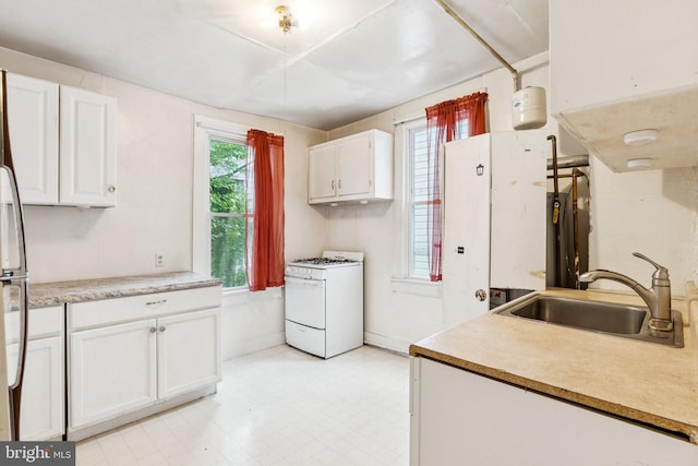 111/2 College Ave, Annapolis, MD 21401 - kitchen featuring white gas range, white cabinets, light flooring, and light countertops