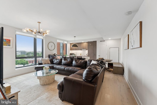 1211 Van St SE Unit 913, Washington, DC 20003 - living area featuring a chandelier and light wood-type flooring