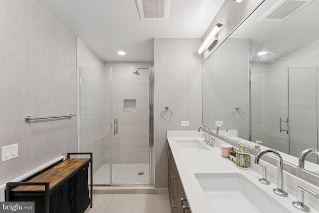 1211 Van St SE Unit 913, Washington, DC 20003 - full bathroom with a shower stall, double vanity, and tile patterned flooring