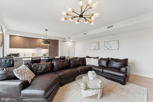 1211 Van St SE Unit 913, Washington, DC 20003 - living area featuring a chandelier, light wood-type flooring, and recessed lighting