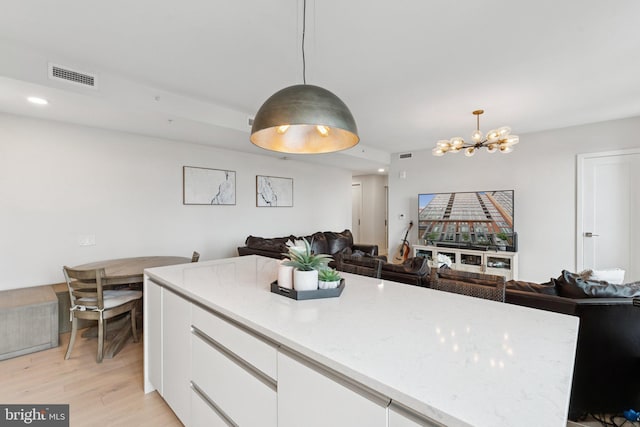 1211 Van St SE Unit 913, Washington, DC 20003 - kitchen featuring white cabinetry, light wood-style flooring, a chandelier, open floor plan, and recessed lighting