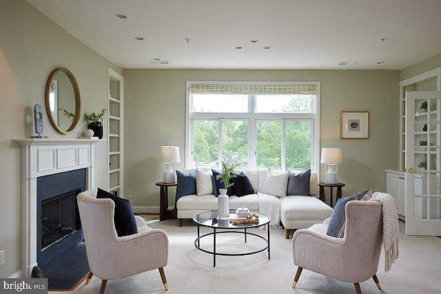 2801 Connecticut Ave NW Unit 32, Washington, DC 20008 - living area featuring a fireplace, built in shelves, light colored carpet, and recessed lighting