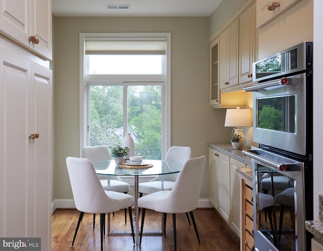 2801 Connecticut Ave NW Unit 32, Washington, DC 20008 - dining space featuring baseboards and wood finished floors