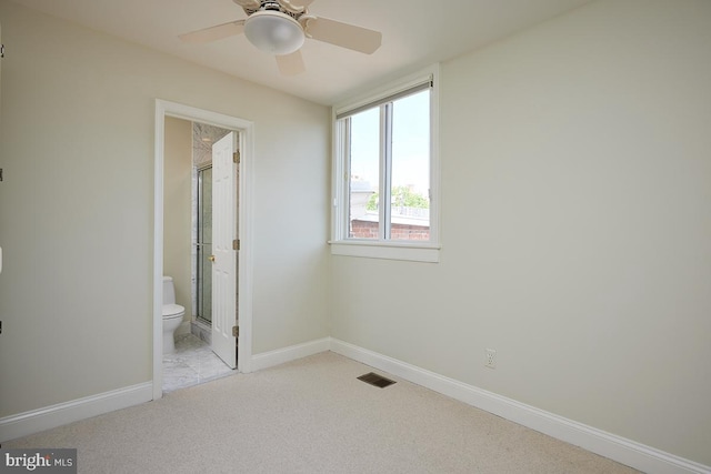 2801 Connecticut Ave NW Unit 32, Washington, DC 20008 - unfurnished bedroom featuring light carpet, ensuite bath, and a ceiling fan