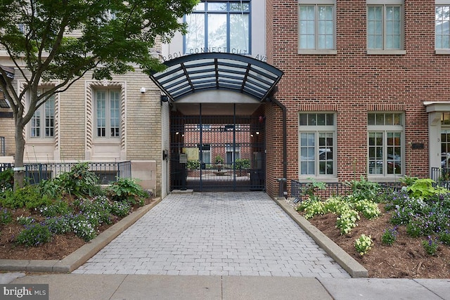 2801 Connecticut Ave NW Unit 32, Washington, DC 20008 - property entrance featuring brick siding and a gate