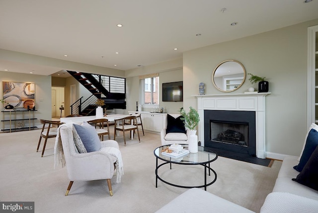 2801 Connecticut Ave NW Unit 32, Washington, DC 20008 - living area featuring stairs, a fireplace with flush hearth, light carpet, and recessed lighting