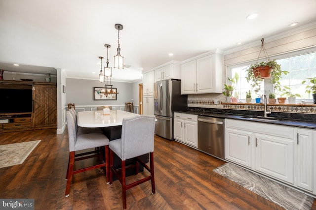 4 Concord Way, Chadds Ford, PA 19317 - kitchen with stainless steel appliances, crown molding, white cabinets, decorative light fixtures, and a kitchen island