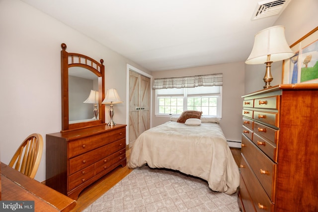 4 Concord Way, Chadds Ford, PA 19317 - bedroom with a baseboard radiator, a closet, and wood finished floors