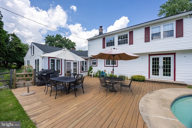 4 Concord Way, Chadds Ford, PA 19317 - deck with french doors, outdoor dining space, grilling area, and an outdoor pool