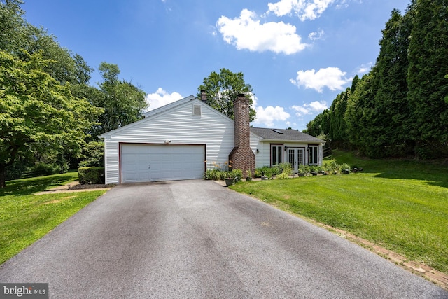 4 Concord Way, Chadds Ford, PA 19317 - ranch-style home featuring a front lawn, driveway, a chimney, french doors, and an attached garage