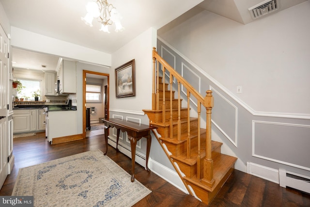 4 Concord Way, Chadds Ford, PA 19317 - stairway featuring a chandelier, baseboard heating, and a baseboard heating unit