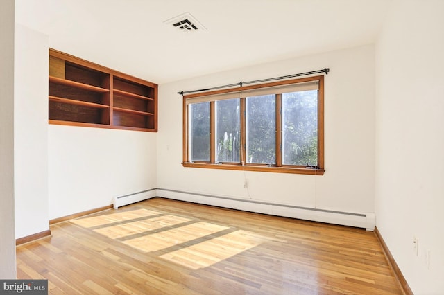 20 Birch Ct, Lancaster, PA 17603 - spare room featuring wood finished floors and a baseboard radiator
